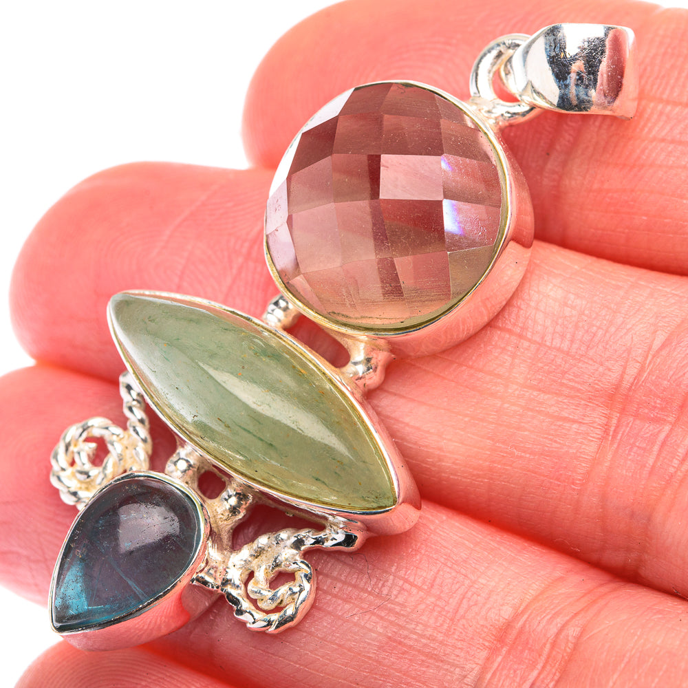 Sterling silver gemstone pendant with green oval and dark blue round stones