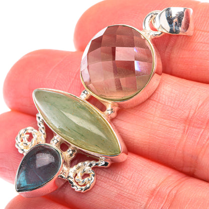 Sterling silver gemstone pendant with green oval and dark blue round stones