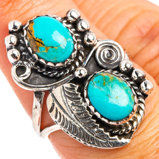 Turquoise and sterling silver oval ring with bezel-set stones and bead details