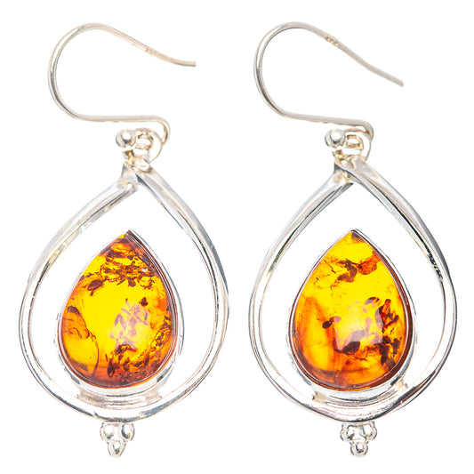 Sterling silver amber teardrop dangle earrings with oval frame, hook backs