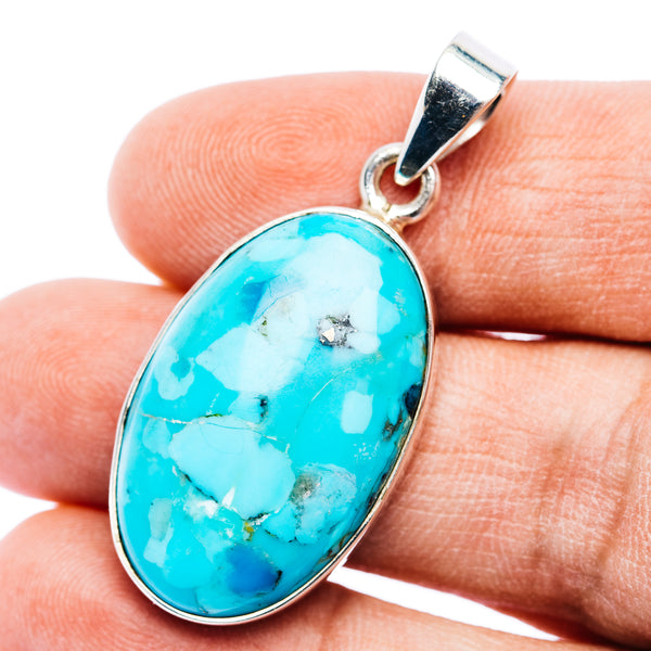 Oval turquoise cabochon pendant in .925 sterling silver with silver bail loop