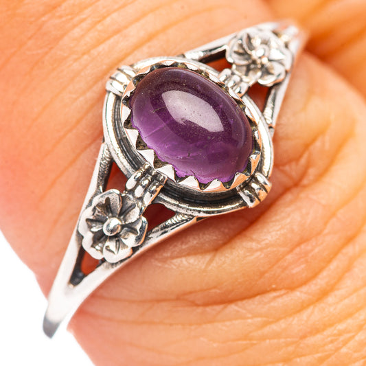 Sterling silver amethyst ring with oval purple stone and floral side accents
