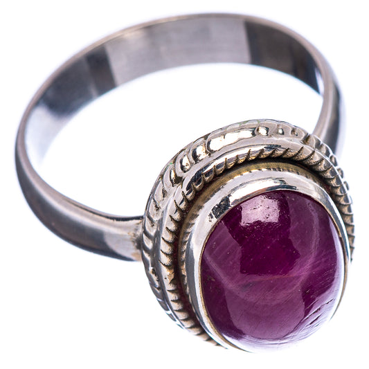 Sterling silver ruby ring with rope-edge setting and round purple gemstone face
