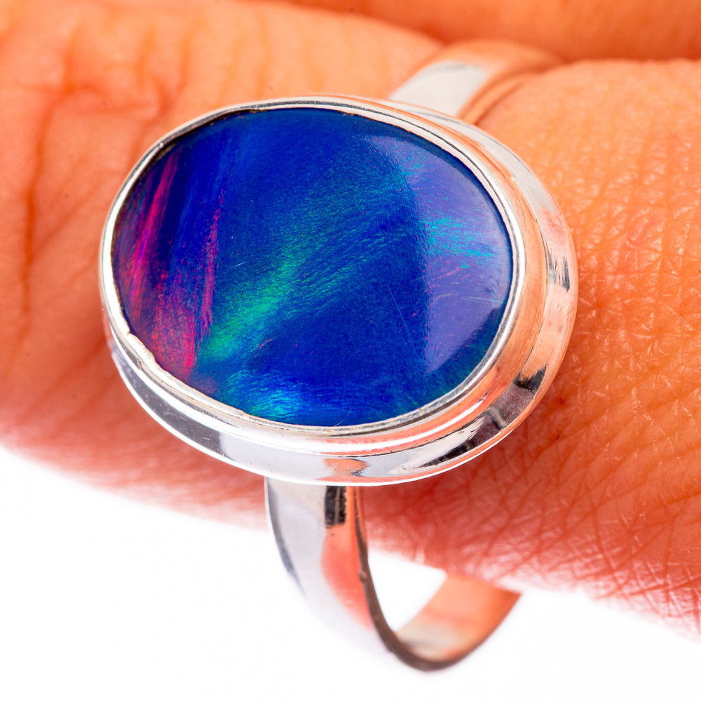 Sterling silver ring with oval blue and purple opal cabochon, polished bezel