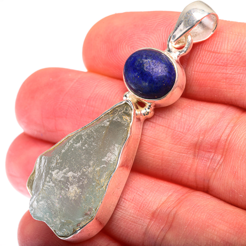 Sterling silver pendant with blue lapis round stone and raw green aquamarine slice