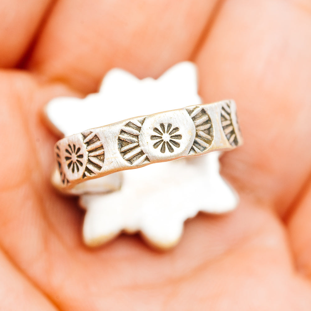 Southwestern silver ring band with etched sunburst and geometric cutout details