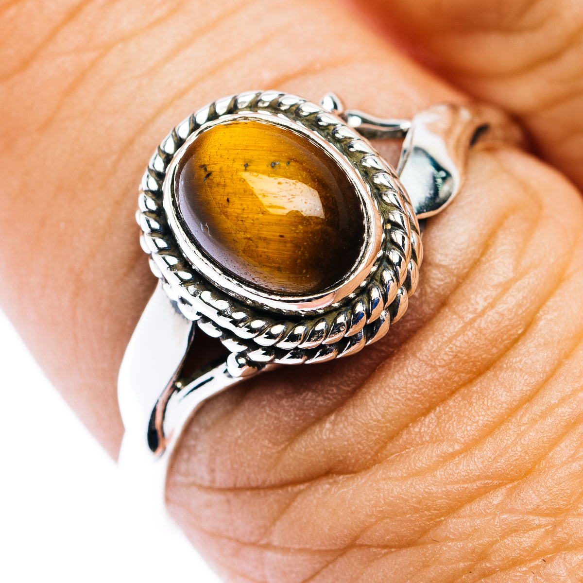 Dainty .925 sterling silver ring with oval tiger's eye gemstone, size 9