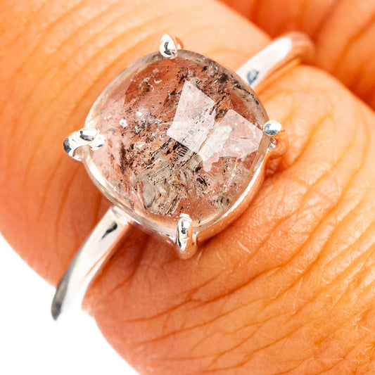 Faceted cacoxenite ring in .925 sterling silver with oval stone and four prongs