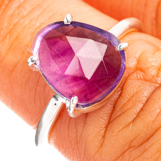 Sterling silver amethyst ring with faceted oval purple gemstone and four prongs