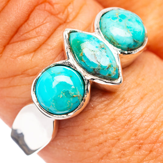 Sterling silver ring with three oval turquoise cabochon stones, bezel set