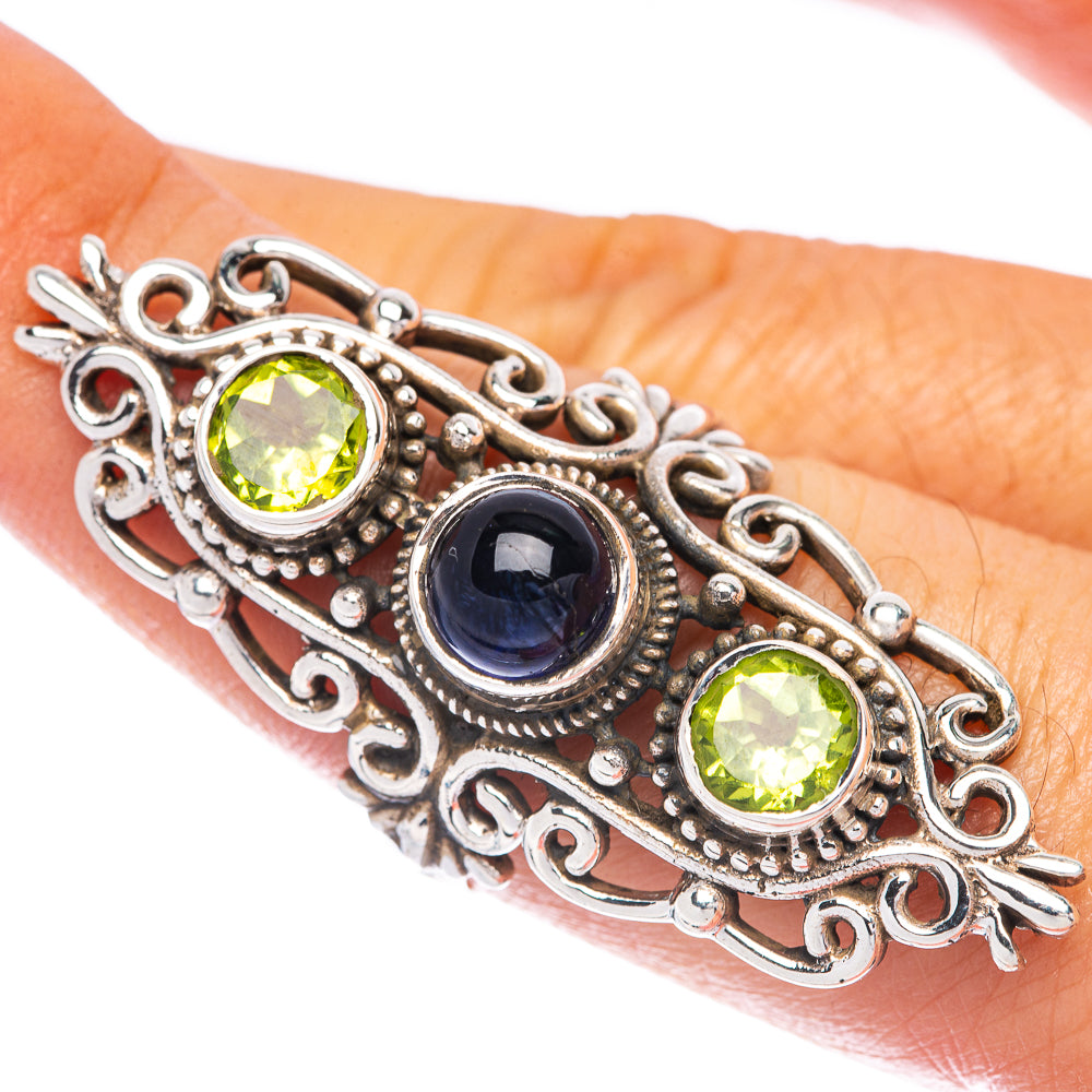 Sterling silver ring with green peridot and blue kyanite gemstones, ornate filigree