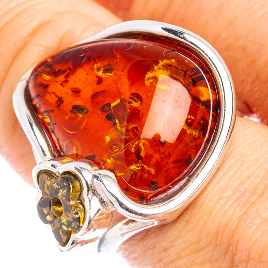 Amber cabochon flower ring in polished .925 sterling silver with oval glowing stone