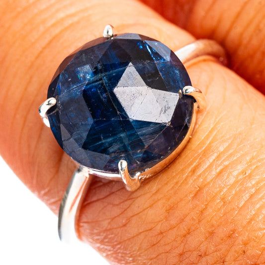 Sterling silver ring with faceted dark blue kyanite oval, four prong setting