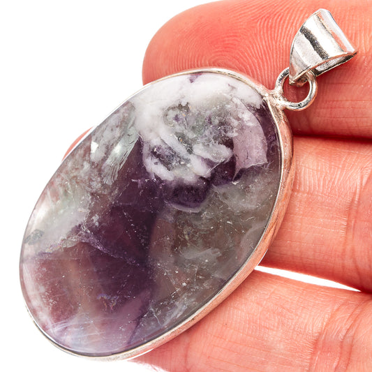 Silver-plated fluorite oval pendant with purple and white gemstone, bail loop at top