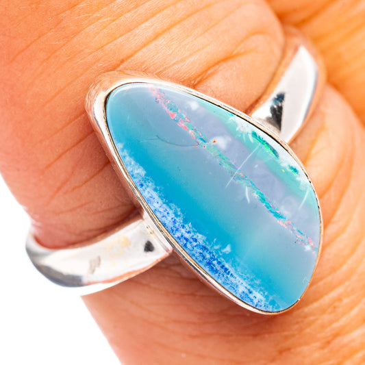 Sterling silver opal ring with oval blue opal cabochon bezel setting