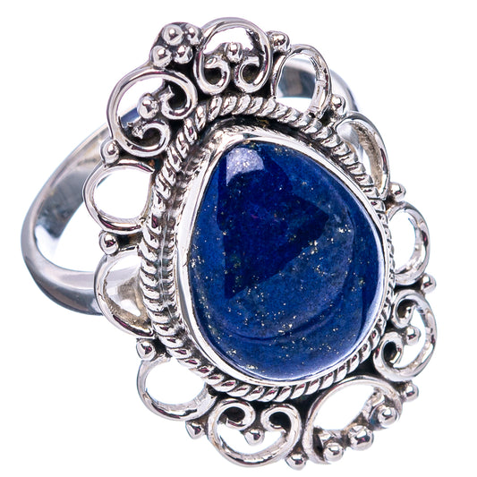 Sterling silver lapis lazuli ring, oval blue gemstone with detailed heart-like side scrolls
