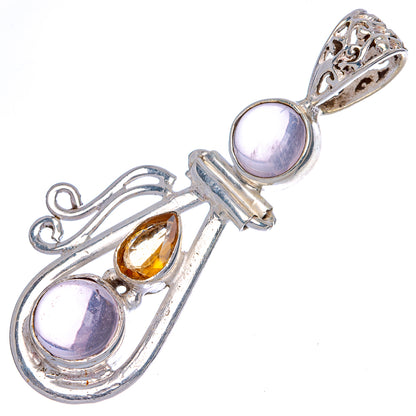 Oval rose quartz and citrine gemstone pendant in ornate sterling silver setting