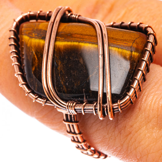 Oxidized copper wire ring with tiger-eye striped oval stone, open band setting