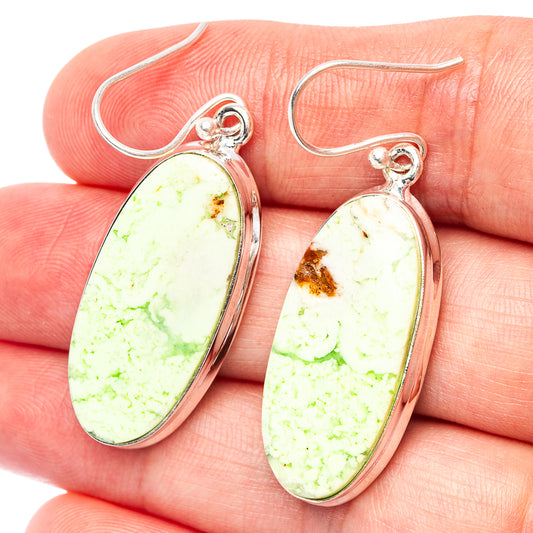 Lemon chrysoprase teardrop earrings with .925 sterling silver hooks and bezel settings.