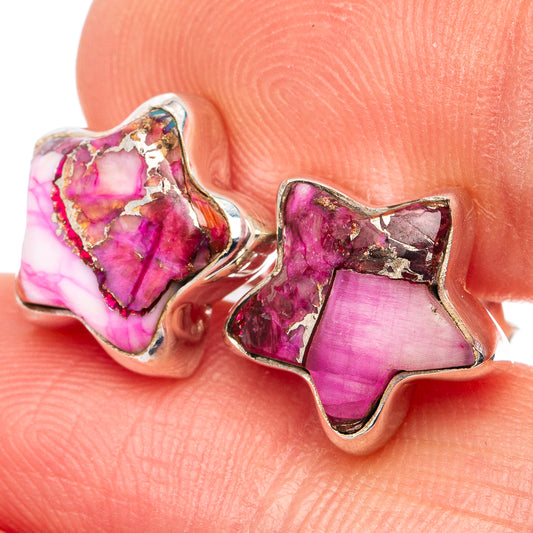 Close-up of pink gemstone star stud earrings with .925 sterling silver settings