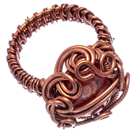 Oxidized copper wire wrap ring with oval red rhodochrosite stone and spiral wire details