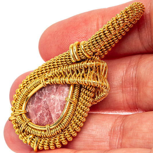 Gold wire wrap teardrop pendant with pink rhodochrosite stone, teardrop setting