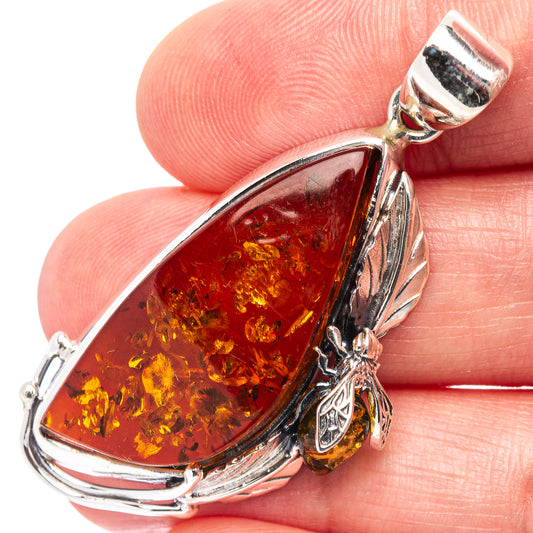 Sterling silver amber teardrop bee pendant with faceted amber core