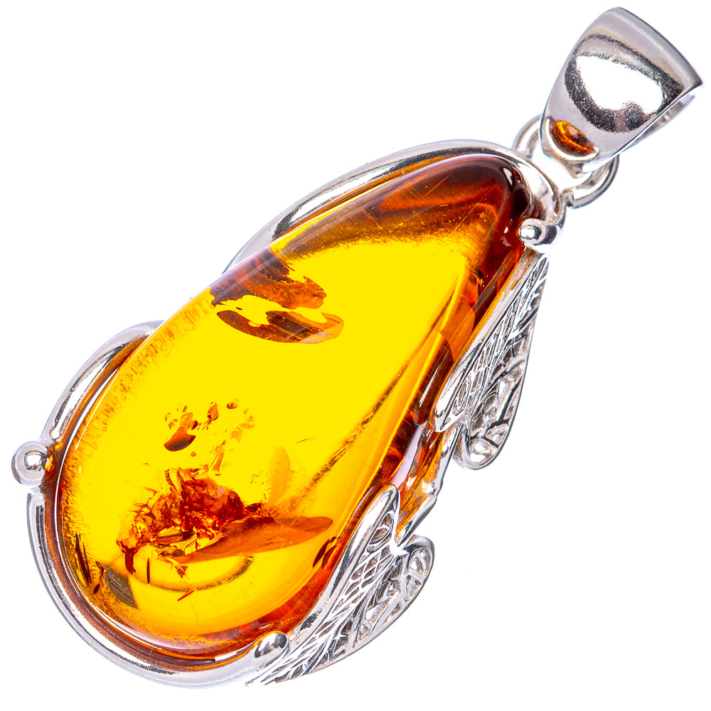Amber teardrop pendant in 925 sterling silver, yellow amber stone with filigree details.