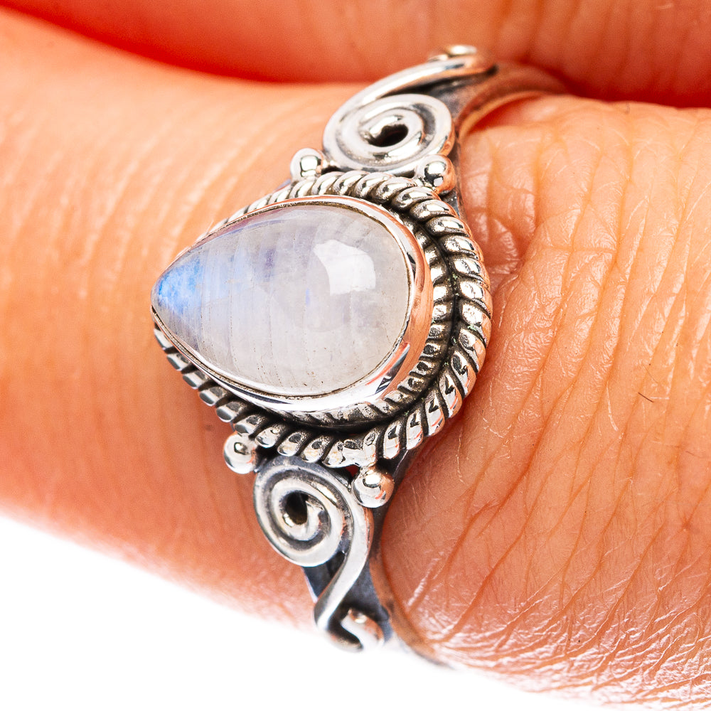 925 sterling silver ring with oval moonstone cabochon, ornate bezel and scroll details