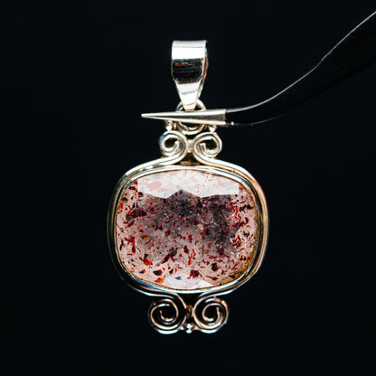 Lepidocrocite pendant in .925 sterling silver with round bezel and red speckled stone