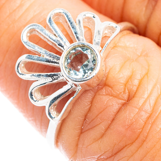 Dainty daisy ring in .925 sterling silver with blue topaz center stone