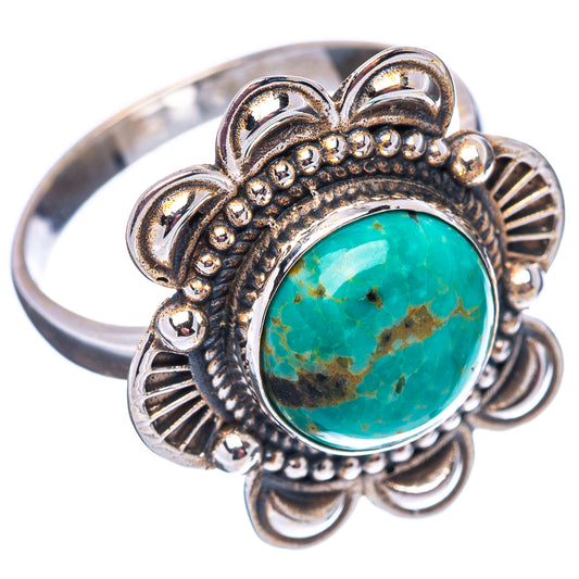 Sterling silver turquoise ring with round cabochon and ornate floral metalwork