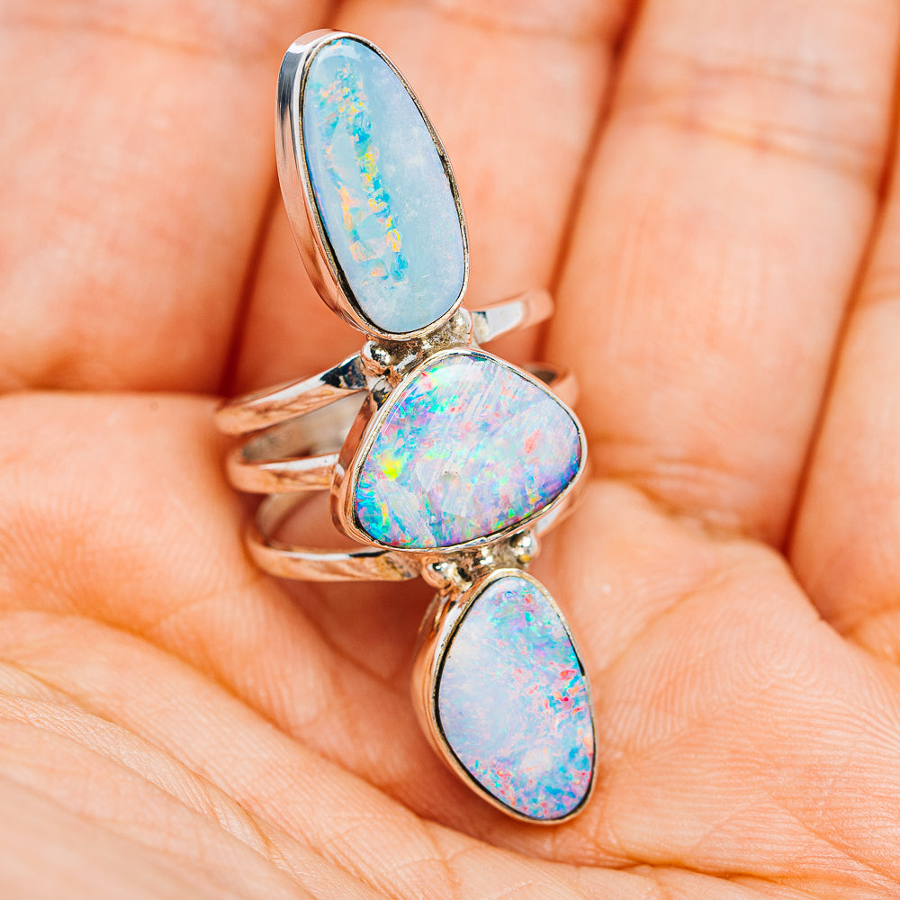 Three-stone sterling silver fire opal ring, oval sky-blue and iridescent cabochons