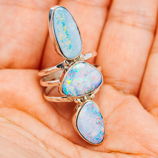 Three-stone sterling silver fire opal ring, oval sky-blue and iridescent cabochons