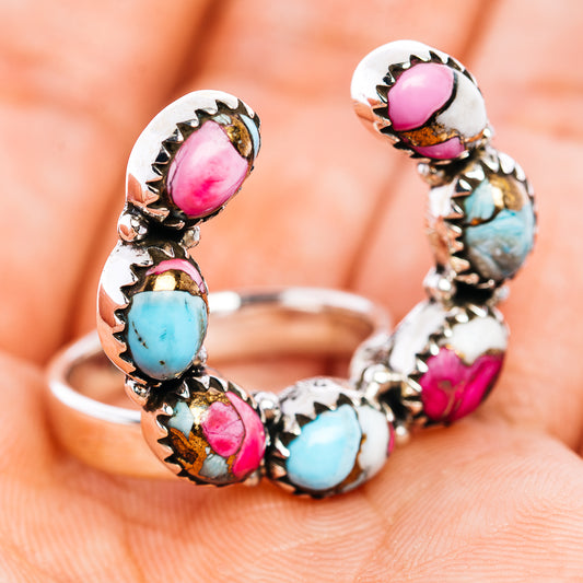 Openwork silver ring with turquoise and pink oval stones, side view