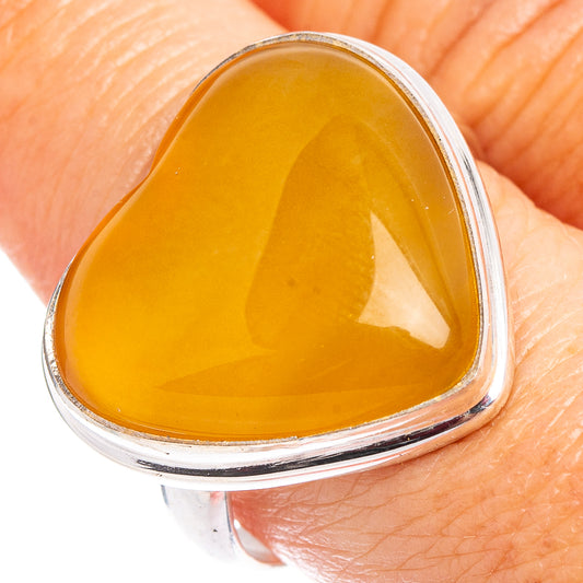 Amber heart cabochon ring with polished .925 sterling silver setting, size 9.25