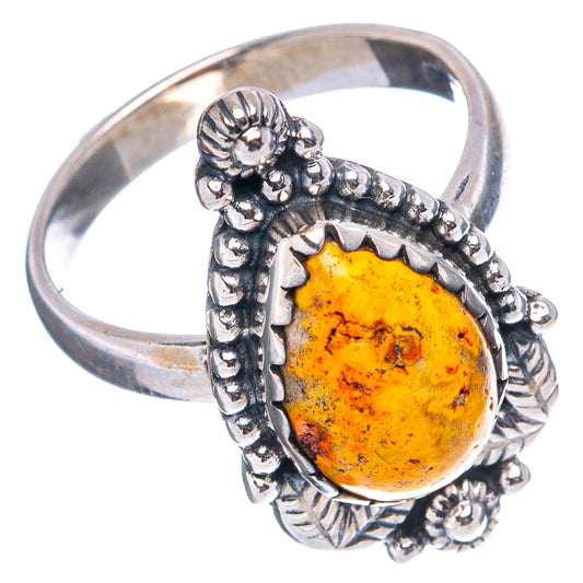 Oval amber jasper ring in .925 sterling silver with scalloped band and decorative side bezels