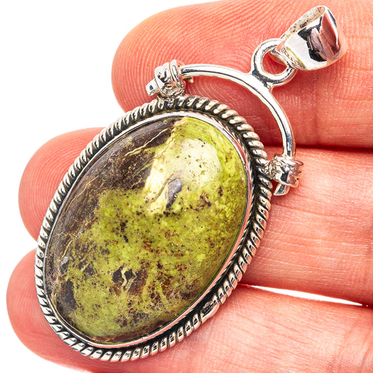 Sterling silver oval gaspeite pendant with green-yellow stone bezel