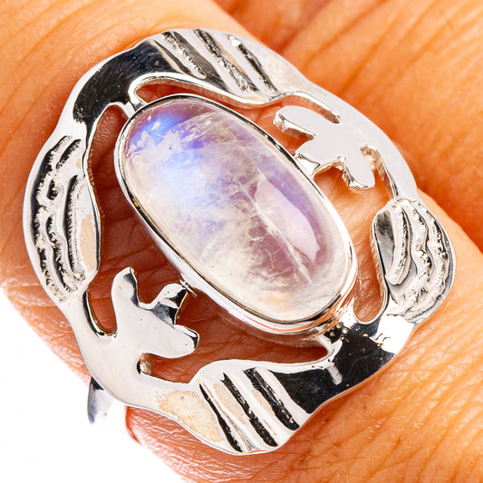 Sterling silver moonstone ring with oval rainbow cabochon and ornate cutout band