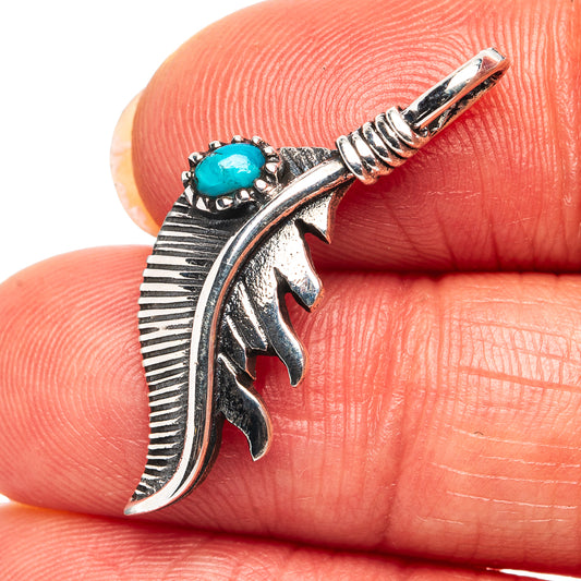 Sterling silver feather pendant with turquoise oval stone and spiral bail