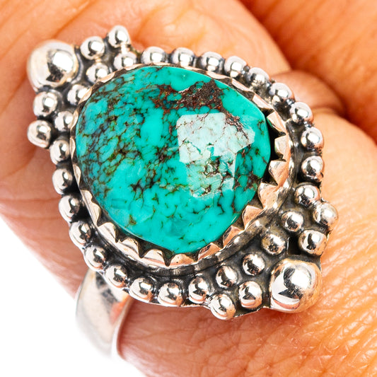 Turquoise oval sterling silver ring with bead-style bezel and textured band
