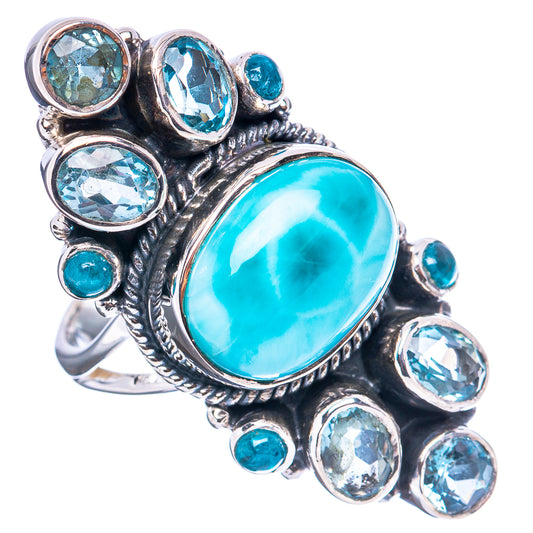 Sterling silver ring with oval turquoise cabochon and blue round stones