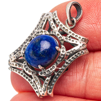 Lapis lazuli pendant with round blue stone cabochon and textured .925 silver border