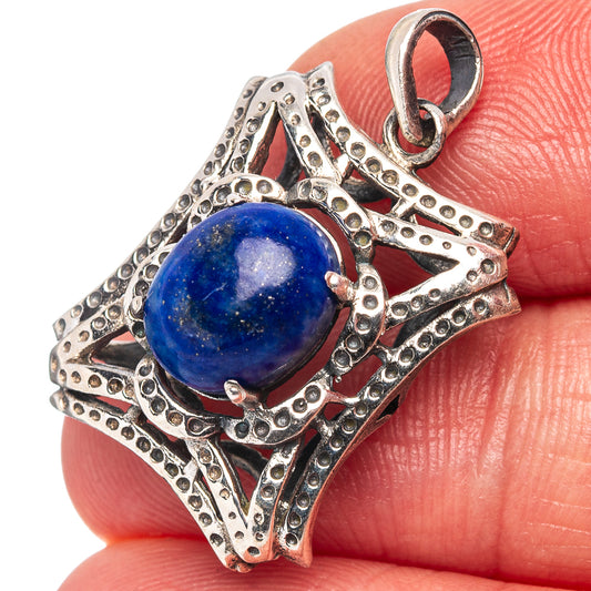 Lapis lazuli pendant with round blue stone cabochon and textured .925 silver border