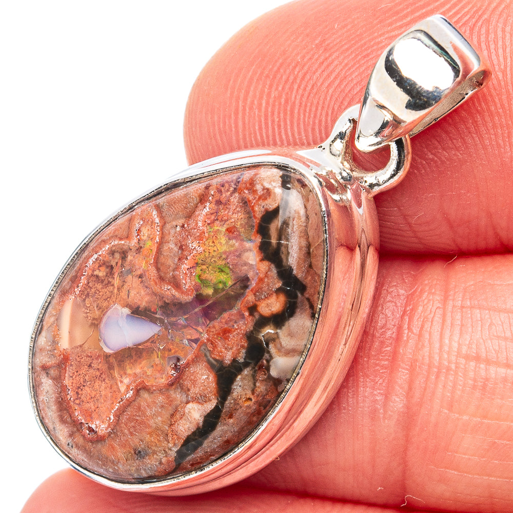 Sterling silver fire opal pendant with oval red-and-brown stone cabochon in bezel