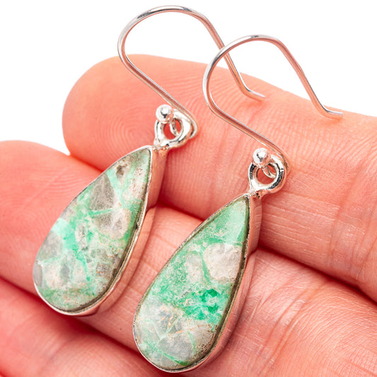 Sterling silver variscite teardrop earrings close-up on hand, green veined stone