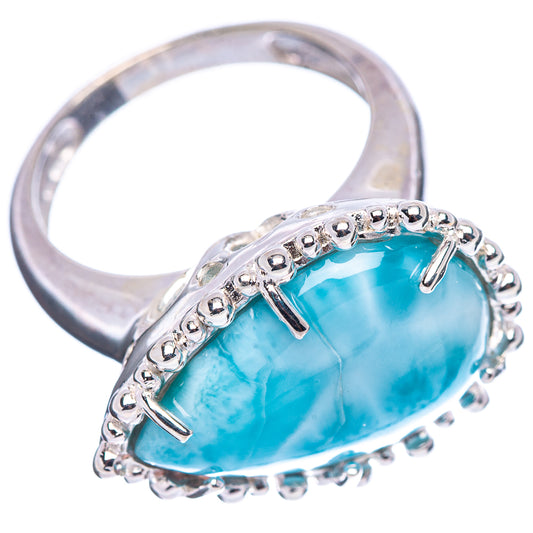 Sterling silver ring with oval turquoise larimar cabochon and side prong settings