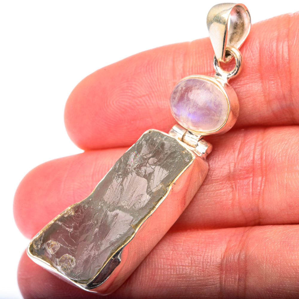 Sterling silver pendant with iridescent moonstone and rough dark aquamarine bar