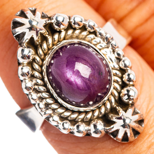 Sterling silver ring with round purple star ruby cabochon and beaded halo setting
