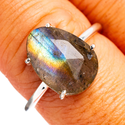 Faceted labradorite oval ring with blue flash, four prongs on sterling silver band
